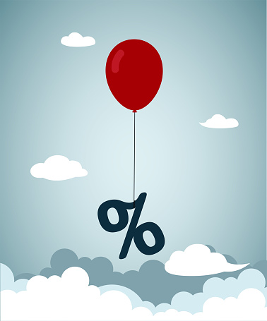 Interest rate, tax or VAT increase, loan and mortgage rate upward trend, investment profit or dividend rising up concept, air balloon tied with percentage symbol flying high rising up in the sky.