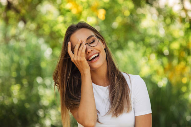 istock Smiling young woman enjoying nature 1398764451