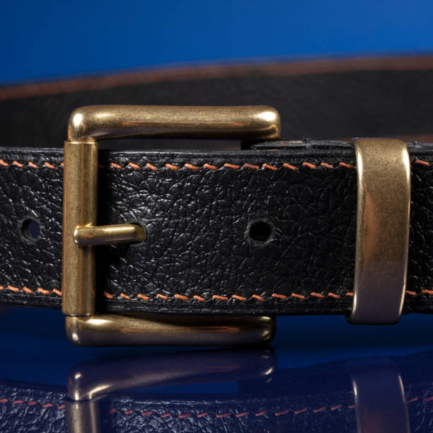 istock Black leather belt on a dark blue background. 1398765226