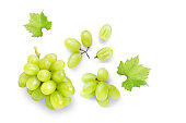Green muscat grapes and half sliced isolated on white background.