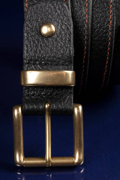 istock Black leather belt on a dark blue background. 1398765251