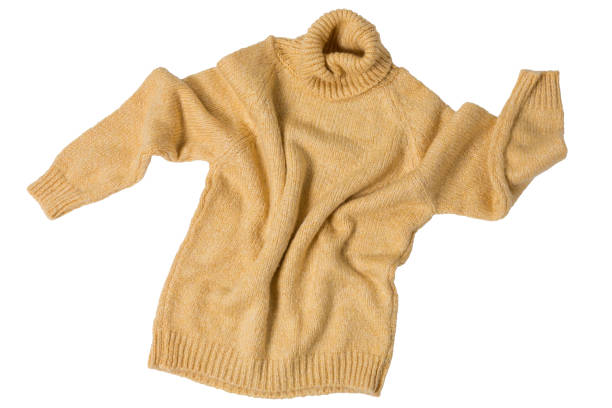 istock yellow wool sweater, on a white background, as if dancing 1398765507