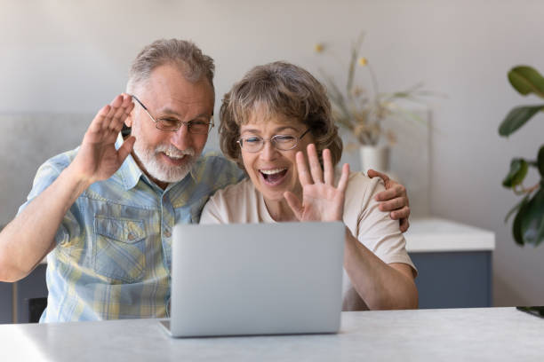 istock Happy middle aged grandparents holding video call conversation. 1398765549