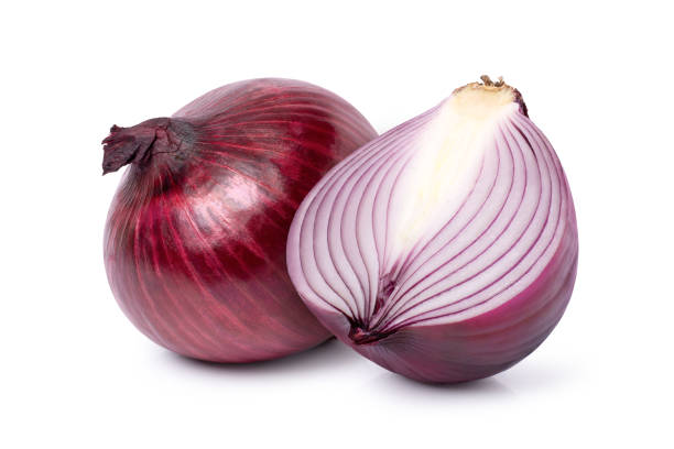 istock red onion and cut in half sliced isolated on white background. 1398765557