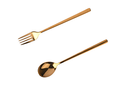 Top view of golden spoon and fork isolated white background