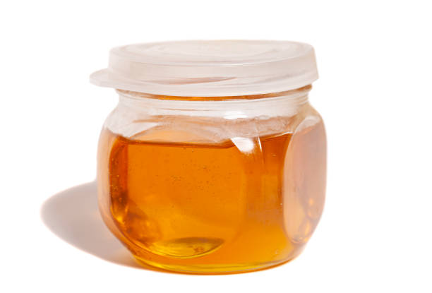 istock glass honey jar isolated on white background 1398769691