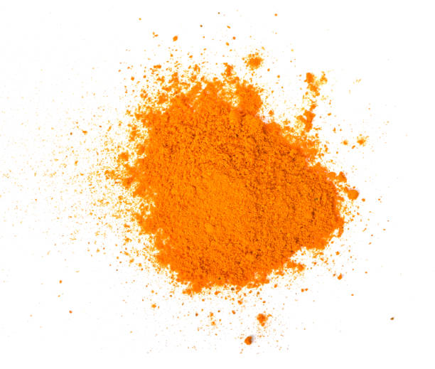 istock Turmeric (Curcuma) powder pile on white background, top view 1398769699