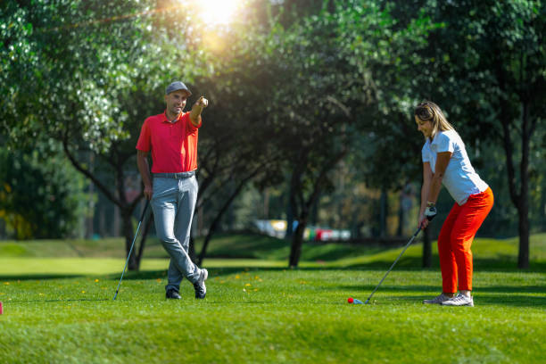istock Golf Vacation For Couples, Playing Golf In A Beautiful Sunny Weather 1398771422