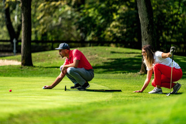 istock Young Couple On A Golf Course, Reading Green 1398771445
