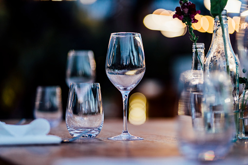 Luxury table settings for fine dining with and glassware, beautiful blurred  background. For events, weddings.  props for weddings, birthdays, and celebration. Wedding, restaurant, party or club.