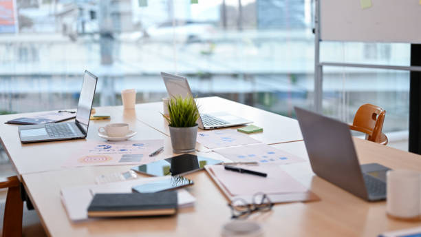 istock Meeting room, conference room. Meeting table with laptop computer 1398775134