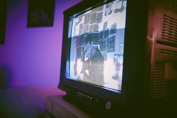 istock Asian man with mental disorder sitting alone at night feeling paranoid on a television. Mixed race man mentally ill, feeling depressed and holding chest in his bedroom. Insomniac having a panic attack 1398775253