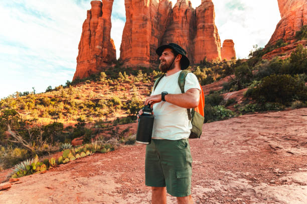 istock Man takes a break from hiking and enjoys nature 1398775646