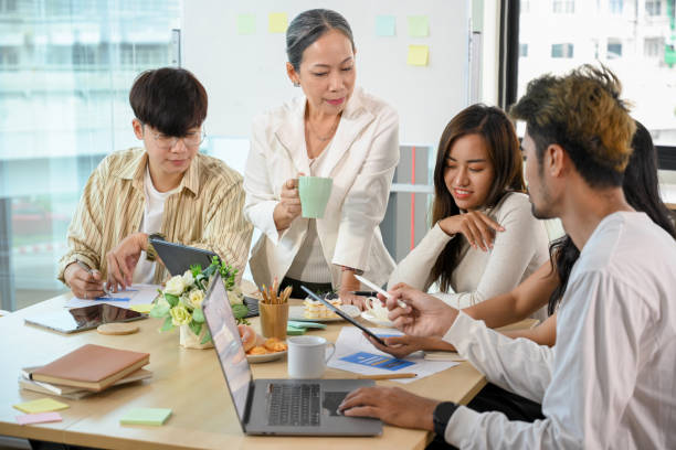 istock A group of millennial developers having a wonderful meeting with senior manager 1398775683