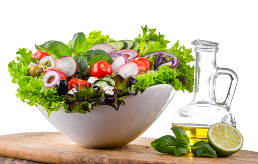Vegetable salad bowl isolated on white background