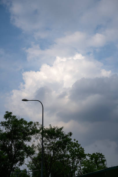 istock Dusk clouds and street lights 1398777953