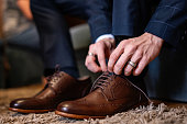 Business man dressing up with classic, elegant shoe