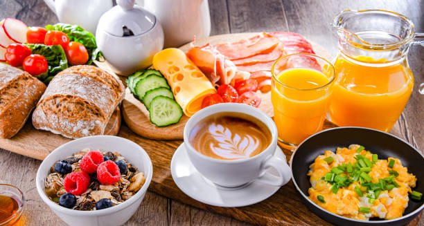 istock Breakfast served with coffee, scrambled eggs, cereals and ham 1398778157