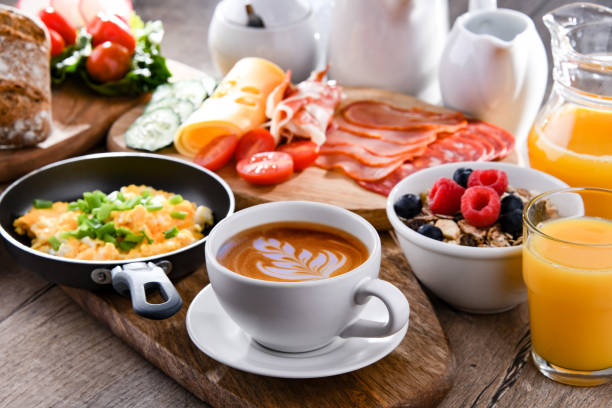 istock Breakfast served with coffee, scrambled eggs, cereals and ham 1398778211