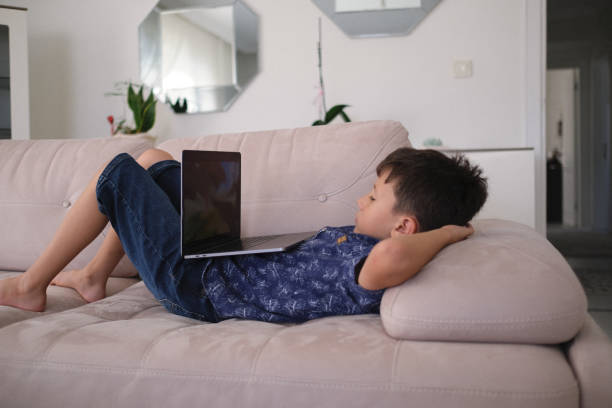 istock cute boy is learning from computer. Homeschooling concept. stock photography 1398778457