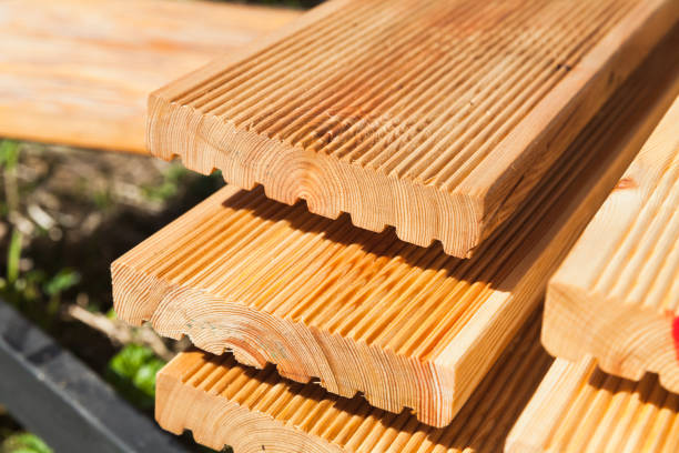 istock Stacked larch deck boards, close up 1398780777
