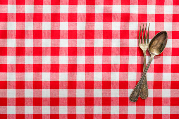 istock Red and white picnic blanket and silverware. Flat lay. Copy space 1398781559