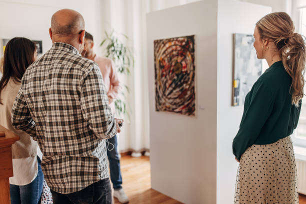 istock People looking at painting 1398782598