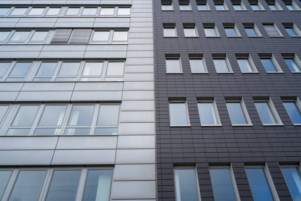 istock Two office buildings together with a light and dark gray facade 1398783947