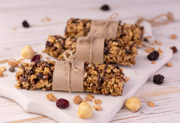 istock Granola bars on a wooden board.Close-up. 1398784176