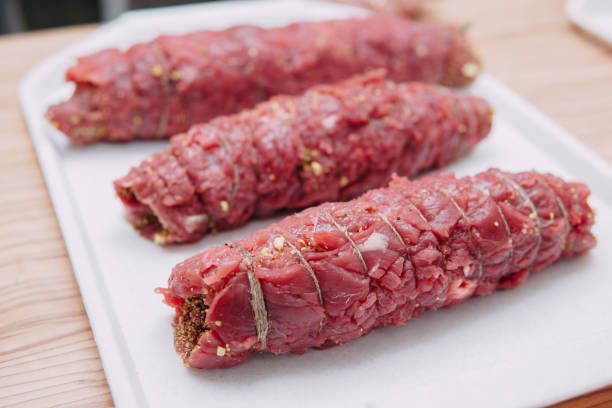 Cooking meat rolls in a cooking class. The beef roll. Raw meat, close-up.