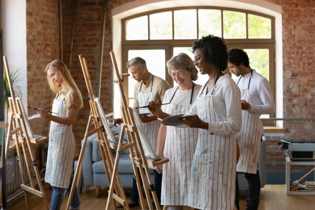 istock Happy African American art class student in drawing in paints 1398786630