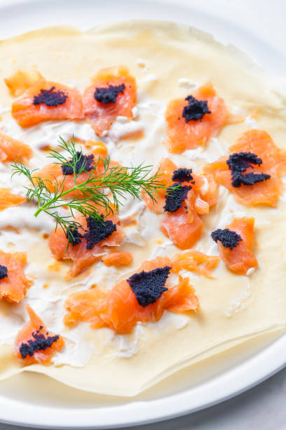 istock pancake with smoked salmon, black caviar and sour cream 1398787329
