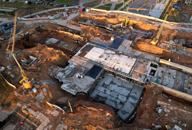 istock Construction site with tower cranes on construction. Foundation slab for monolithic reinforced. 1398787397