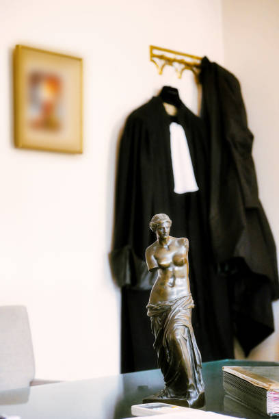 gavel hammer with bride and groom figurine against white background