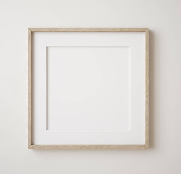 Square frame mockup close up on wall painted beige color Square frame mockup close up on wall painted beige color, 3d render picture frame stock pictures, royalty-free photos & images