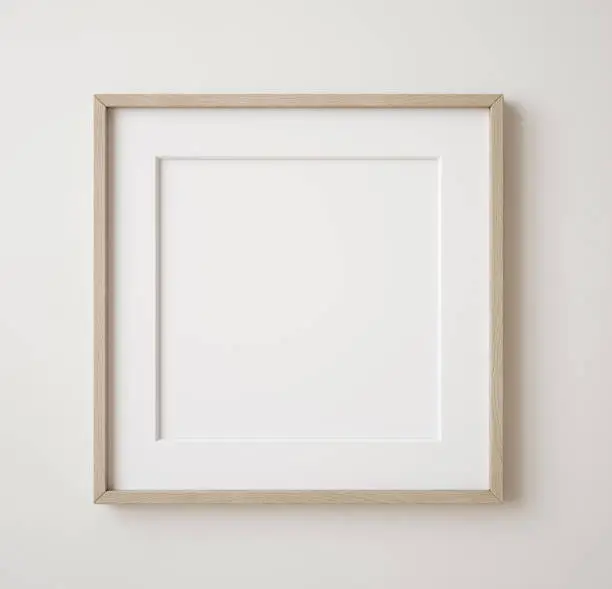 Photo of Square frame mockup close up on wall painted beige color