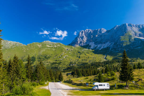 istock Caravan in summer mountain landscape, Alps, Italy 1398789006