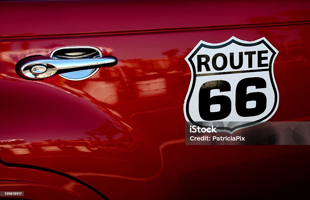 Route 66 A sign for the famous Route 66 highway on the side of a car. Car Stock Photo