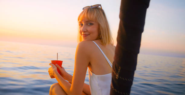 istock Woman sitting on sailing boat 1398792880