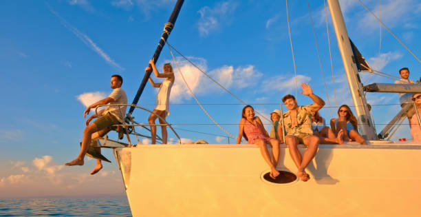 istock Friends sitting on sailboat 1398793085