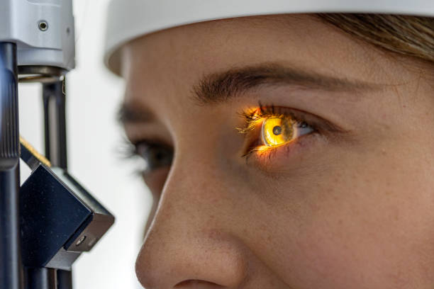 istock Beautiful young on eyesight exam macro 1398793434