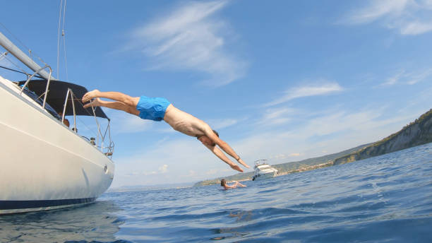 istock Man jumping in sea 1398793524