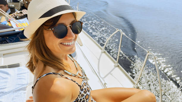 istock Woman sitting on sailing boat 1398793555