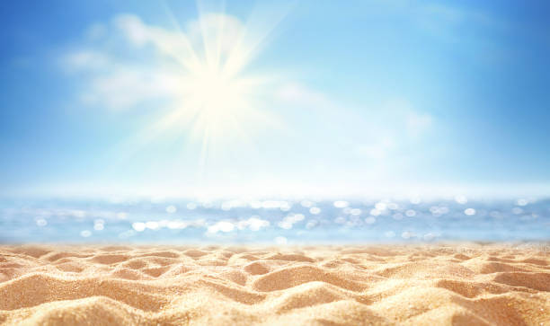 istock Golden sand beach, sea water against blue sky with white clouds, empty space for text. 1398798365