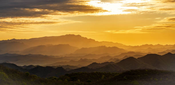 istock Layers of mountain in yellow morning sunlight 1398799827