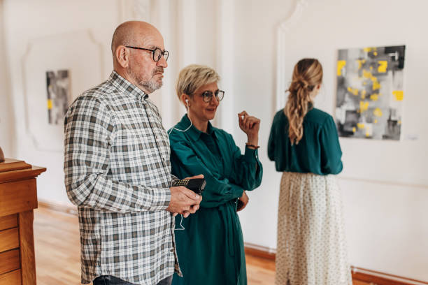 istock Couple in art gallery 1398800130