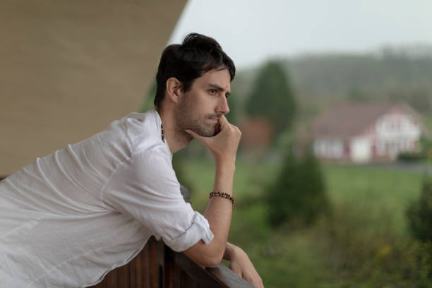 istock Man pensively contemplates the surroundings 1398800697