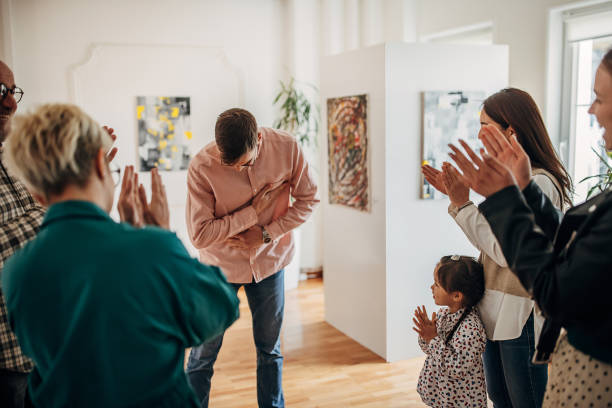 istock People applauding at gallery opening 1398802202