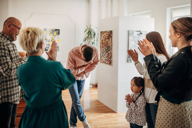 istock People applauding at gallery opening 1398802333