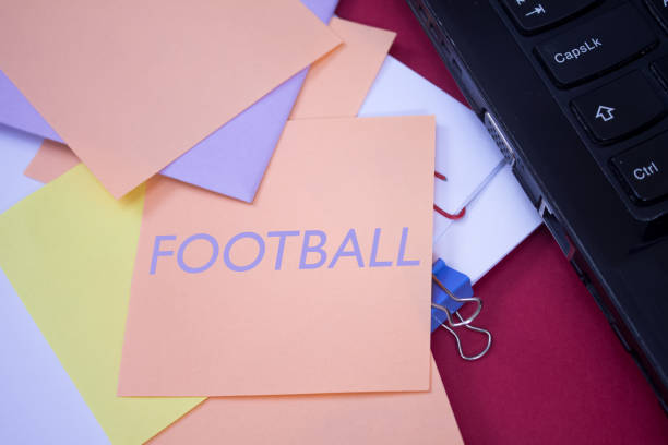 Football. Text on adhesive note paper. Football. Text on adhesive note paper. Event, celebration reminder message. club soccer photos stock pictures, royalty-free photos & images